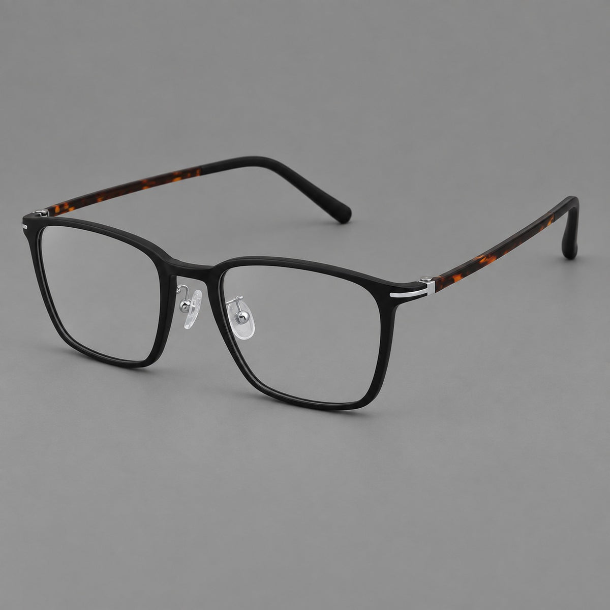 Modern square plastic eyeglasses with a smooth browline and slim metal corner details in Matte Black, three quarter view