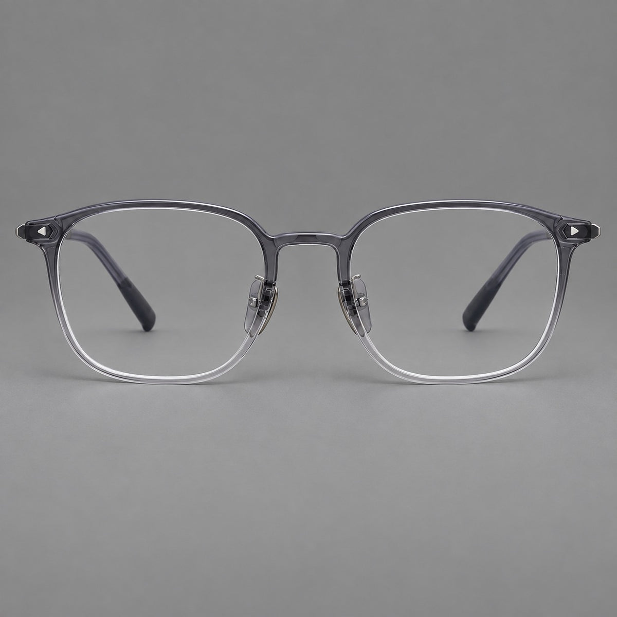 Retro square plastic eyeglasses with a curved bridge and triangular corner details in Ink Grey, front view