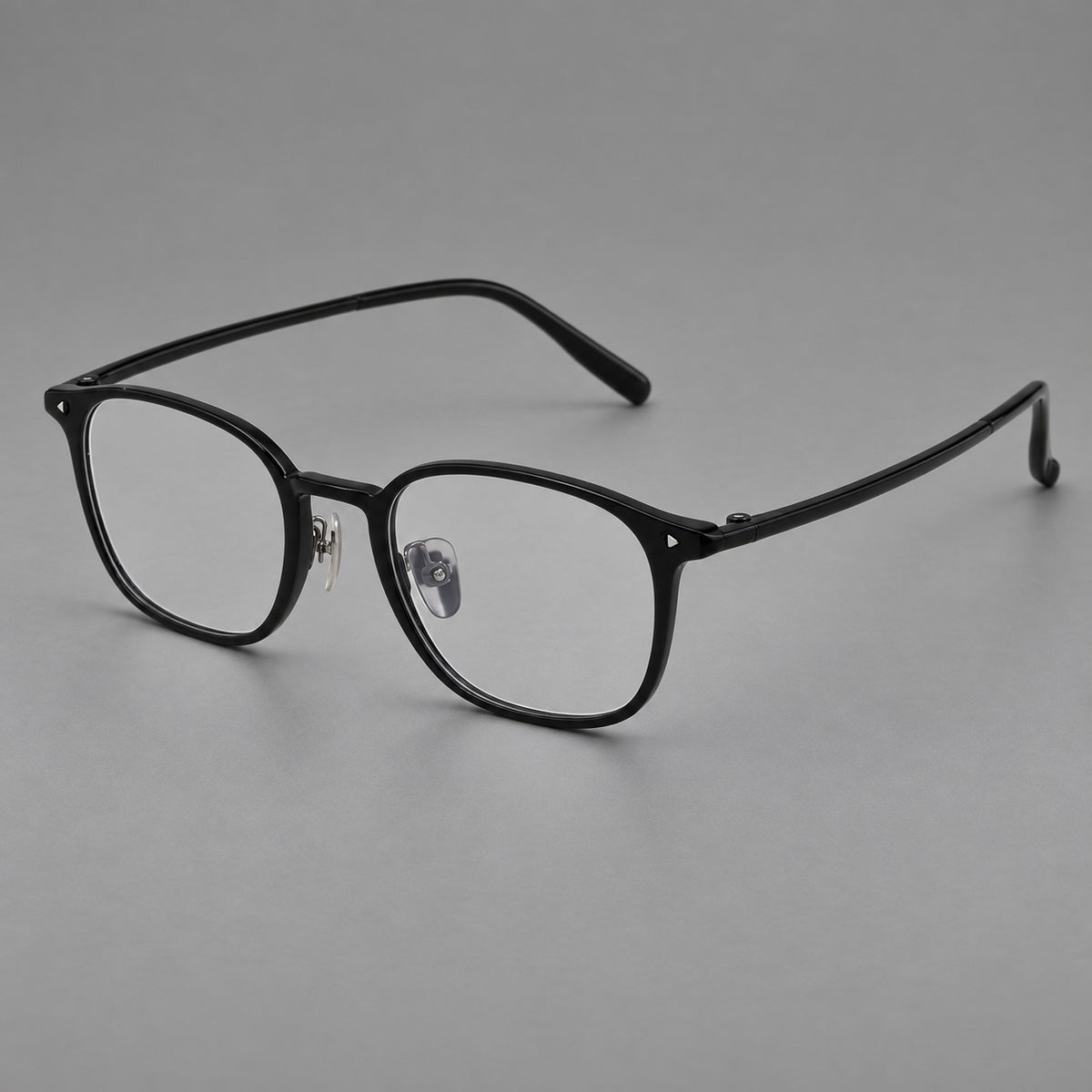 Retro square plastic eyeglasses with a curved bridge and triangular corner details in Glossy Black, three quarter view