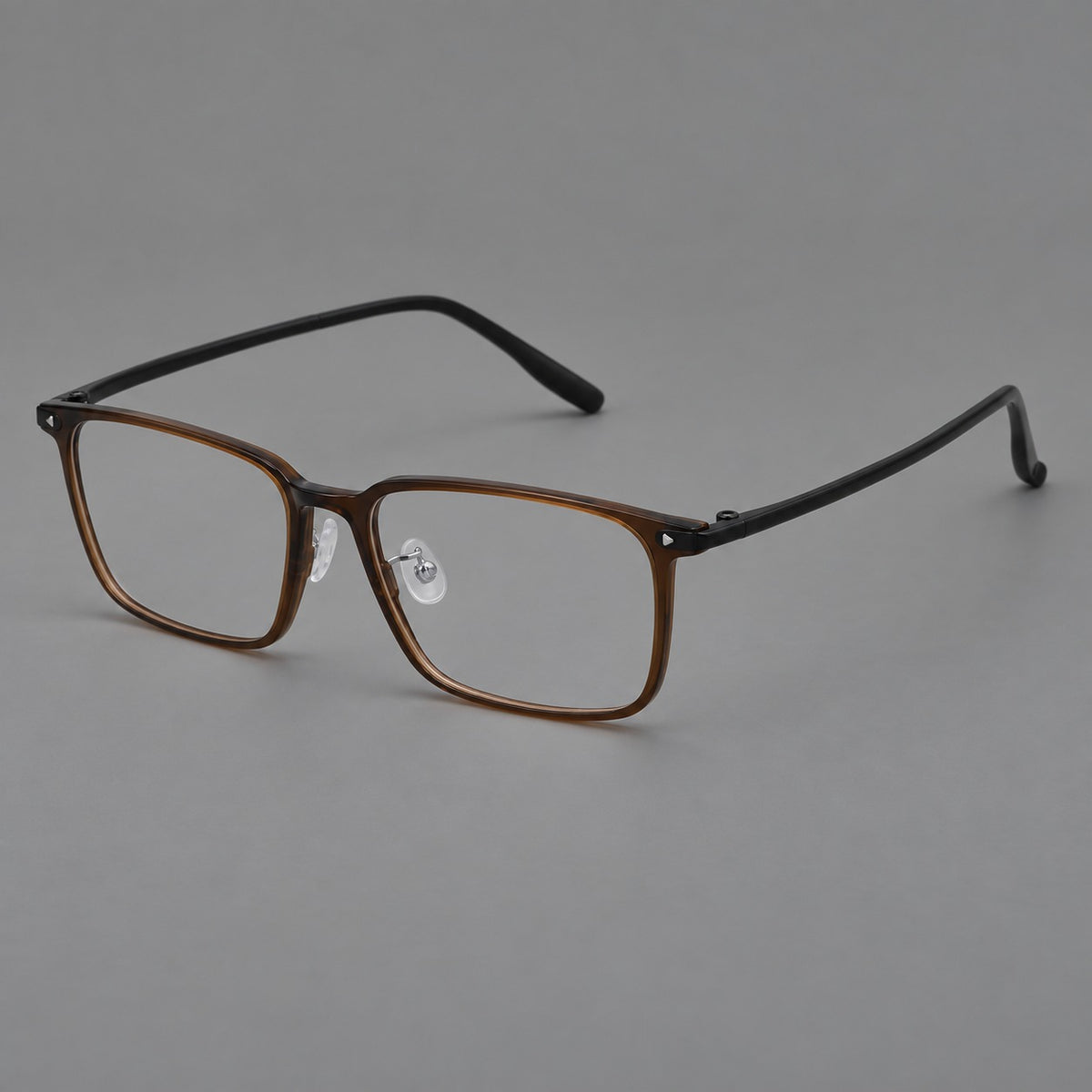 Wide rectangular plastic eyeglasses with an angular browline and slender rims in Tea Brown, three quarter view