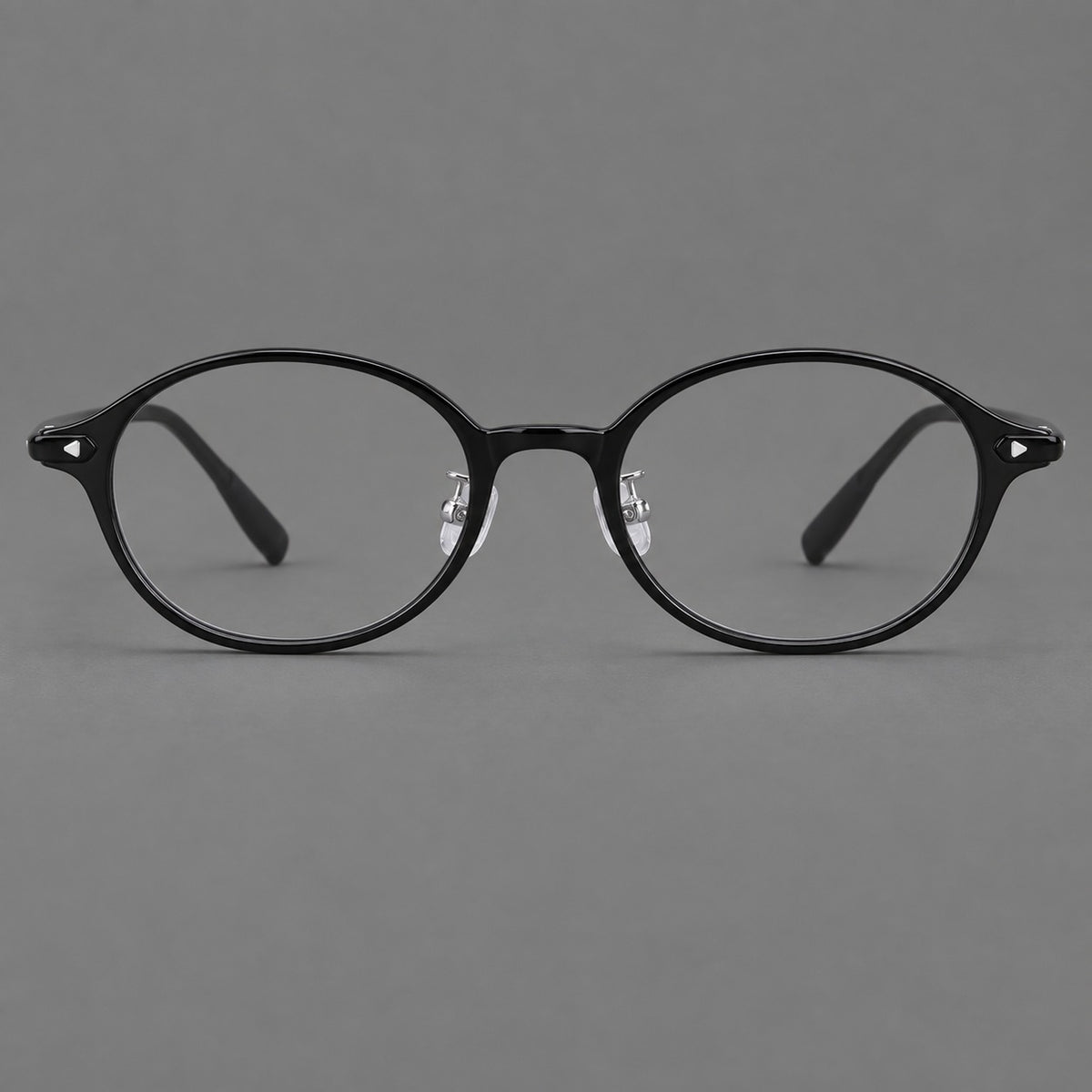 Retro round plastic eyeglasses with softly lifted corners and a sculpted bridge in Glossy Black, front view