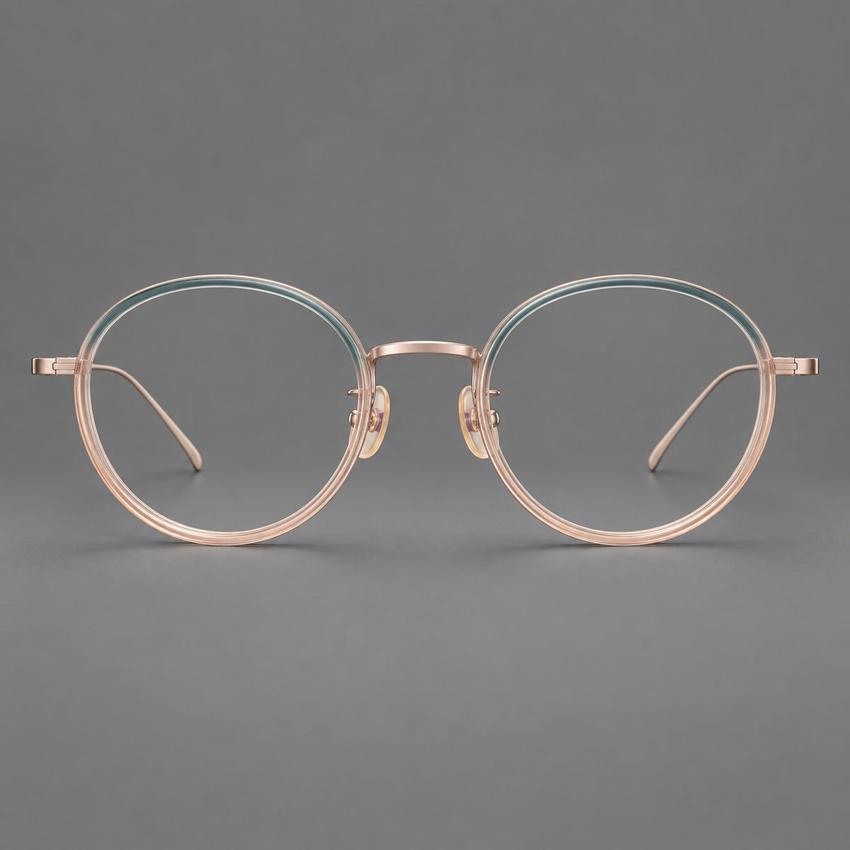 Classic round eyeglasses in acetate and titanium with slim rims and textured metal temples in Blue Tea Gradient / Rose Gold, front view