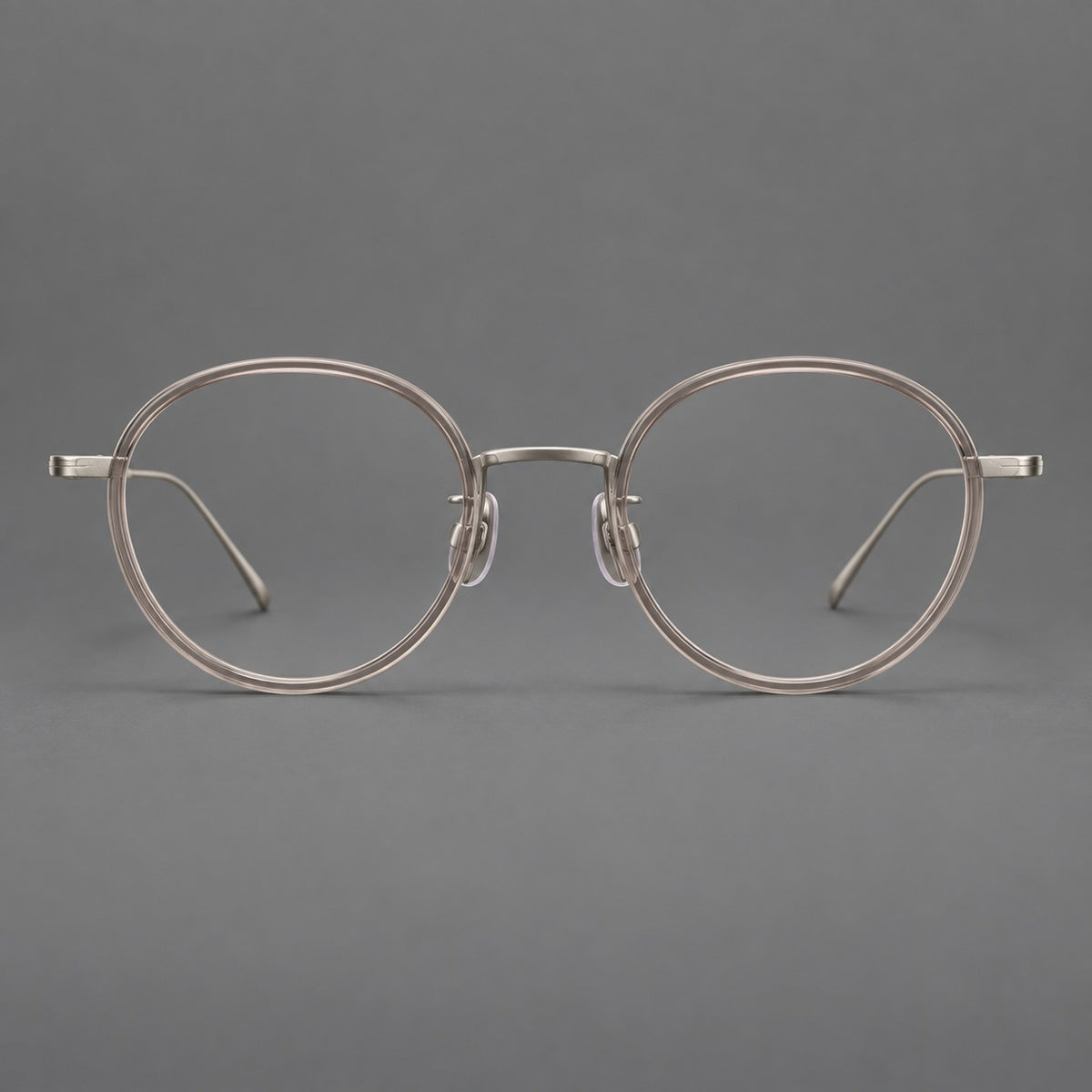 Classic round eyeglasses in acetate and titanium with slim rims and textured metal temples in Grey Pink Gradient / Gunmetal, front view