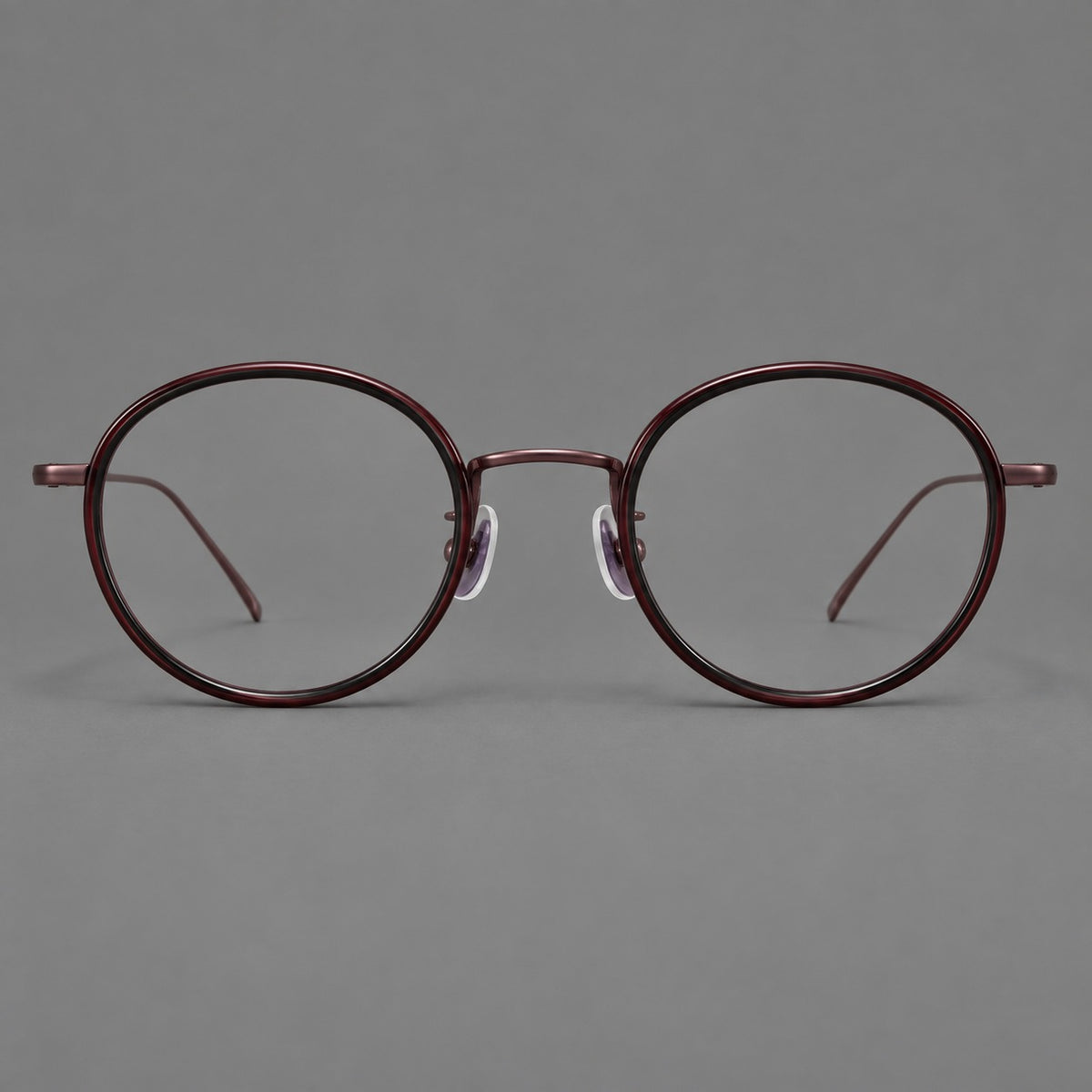 Classic round eyeglasses in acetate and titanium with slim rims and textured metal temples in Glossy Black / Wine Red, front view