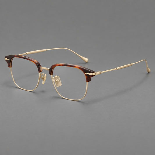 Browline eyeglasses in acetate and titanium with slim metal lower rims and decorative corners in Tortoiseshell / Gold, three quarter view