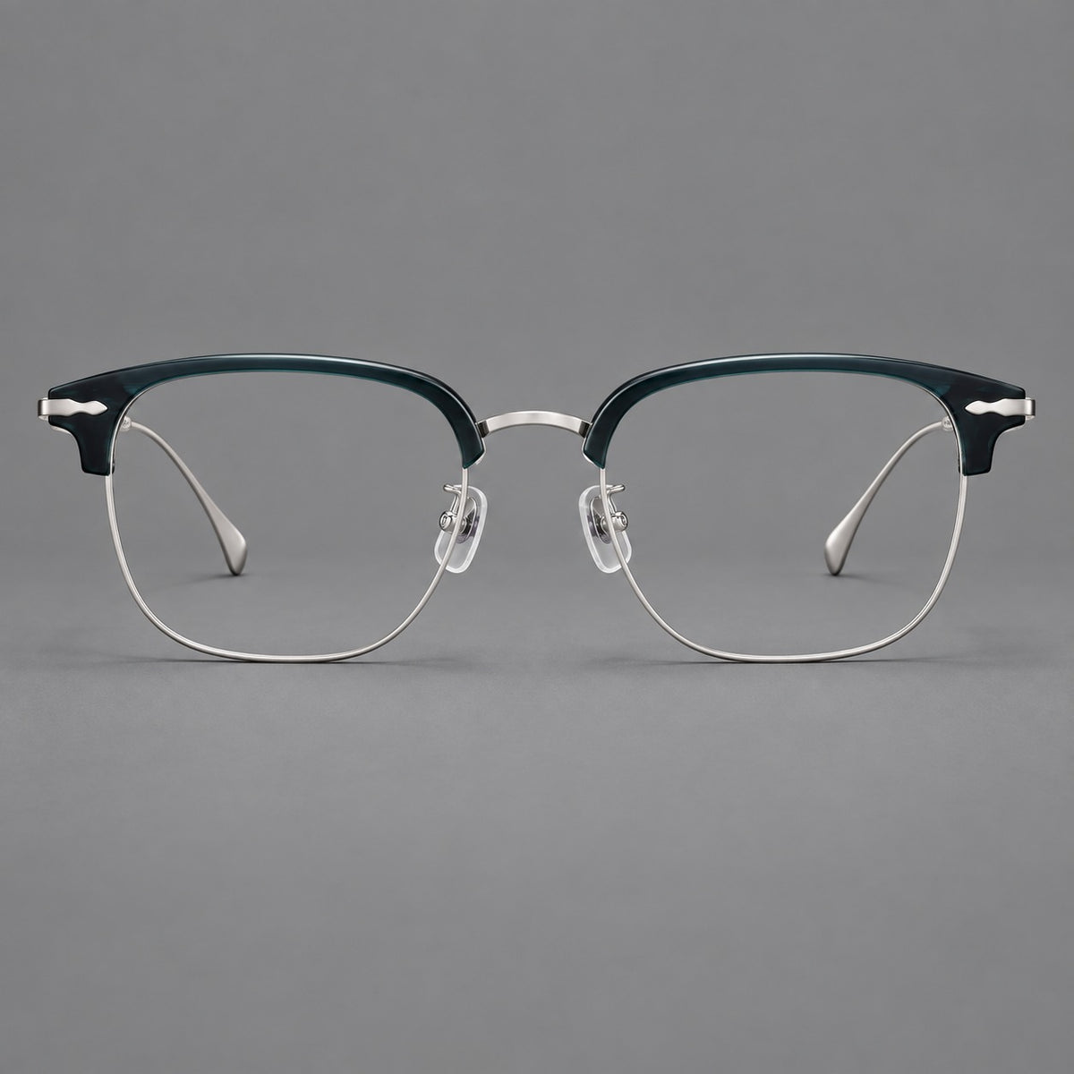 Browline eyeglasses in acetate and titanium with slim metal lower rims and decorative corners in Peacock Blue / Silver, front view