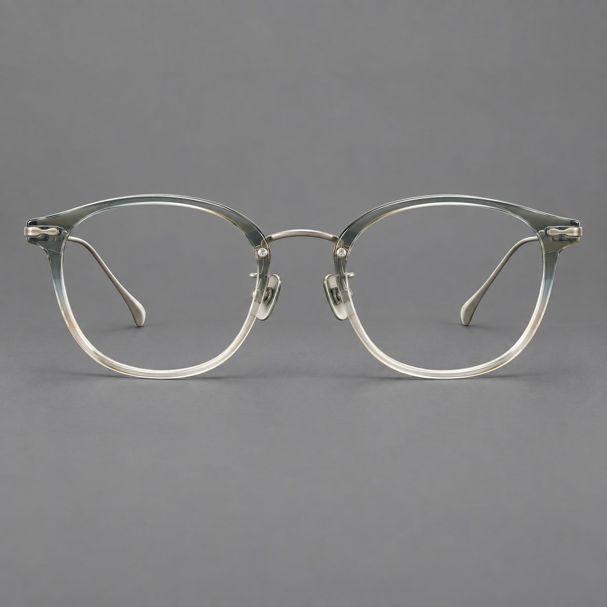 Panto eyeglasses in acetate and titanium with curved brows and decorative metal corner accents in Ice Blue Tea / Silver, front view