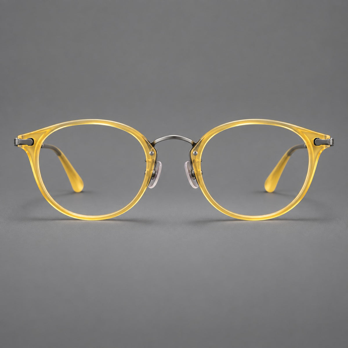 Vintage panto eyeglasses in acetate and titanium with raised brows and textured metal temples in Lemon Yellow / Gunmetal, front view