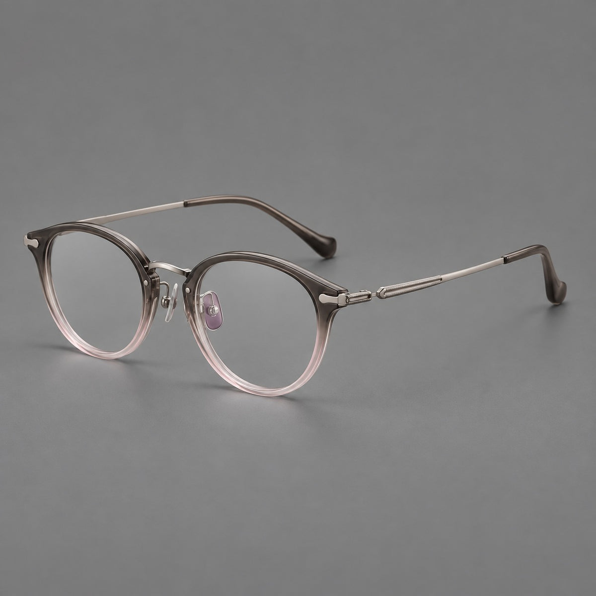 Vintage panto eyeglasses in acetate and titanium with raised brows and textured metal temples in Mist Pink Gradient / Gunmetal, three quarter view