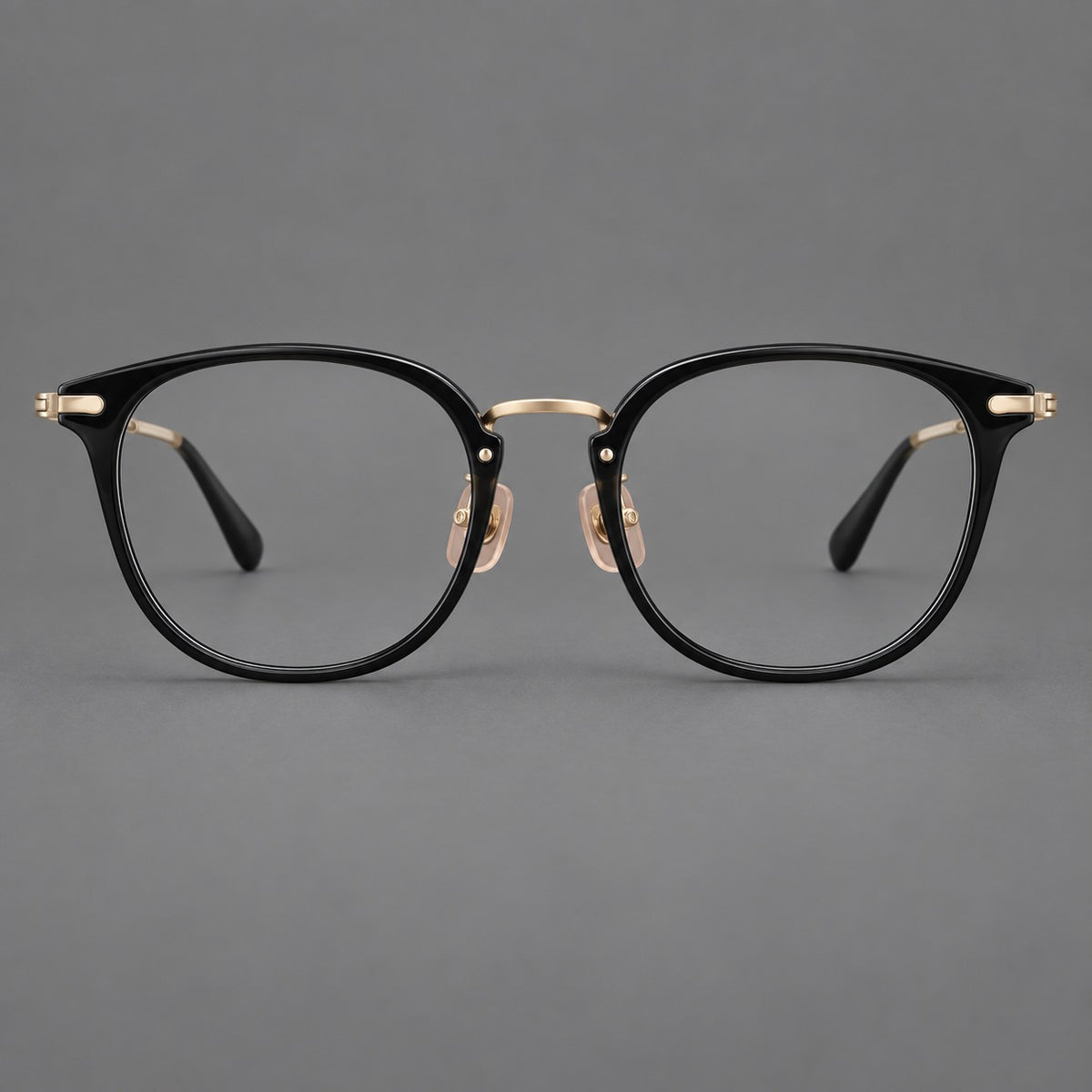 Classic soft square eyeglasses in acetate and titanium with engraved temples and corner accents in Glossy Black / Gold, front view