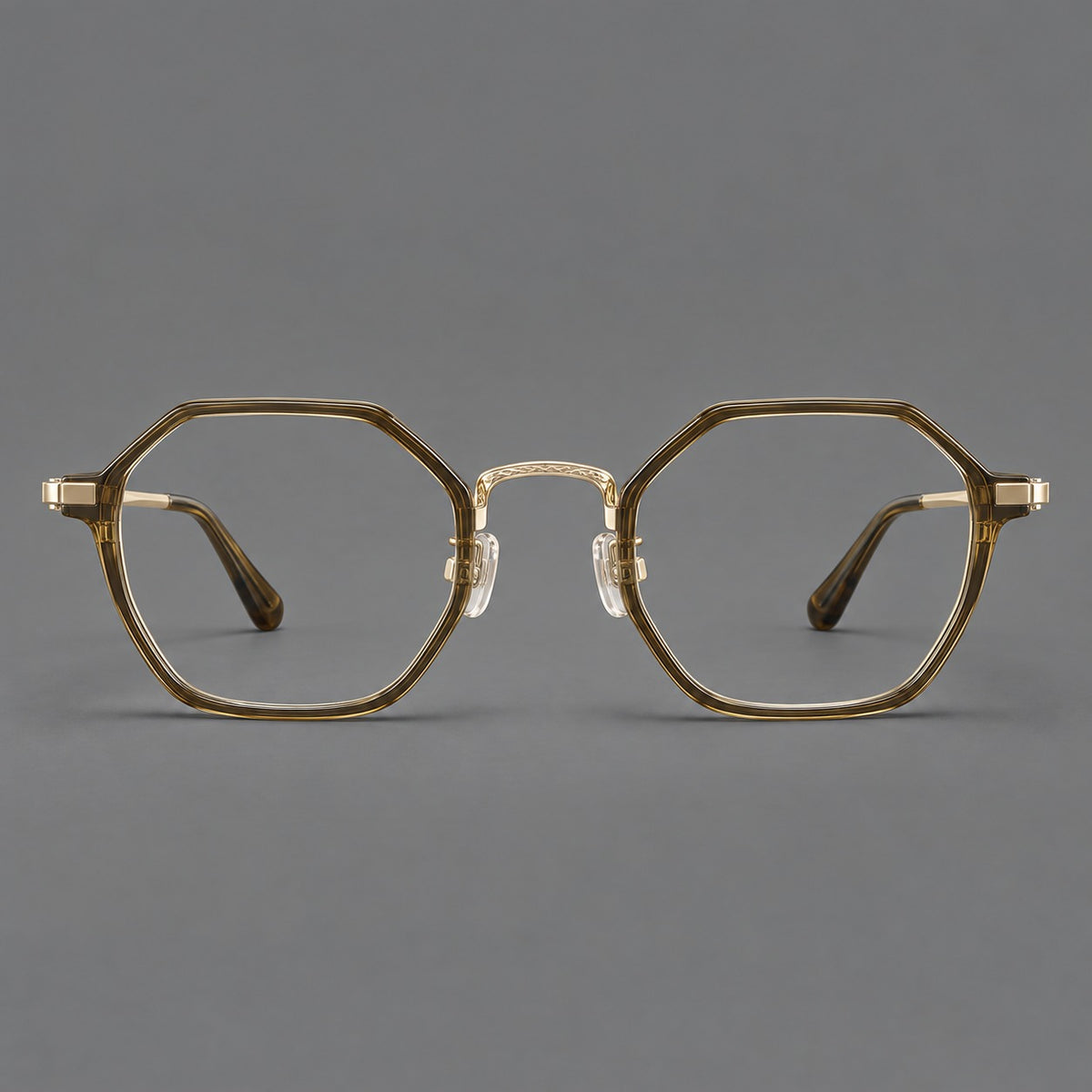 Geometric eyeglasses in acetate and titanium with octagonal rims and a textured metal bridge in Clear Tea Green / Light Gold, front view