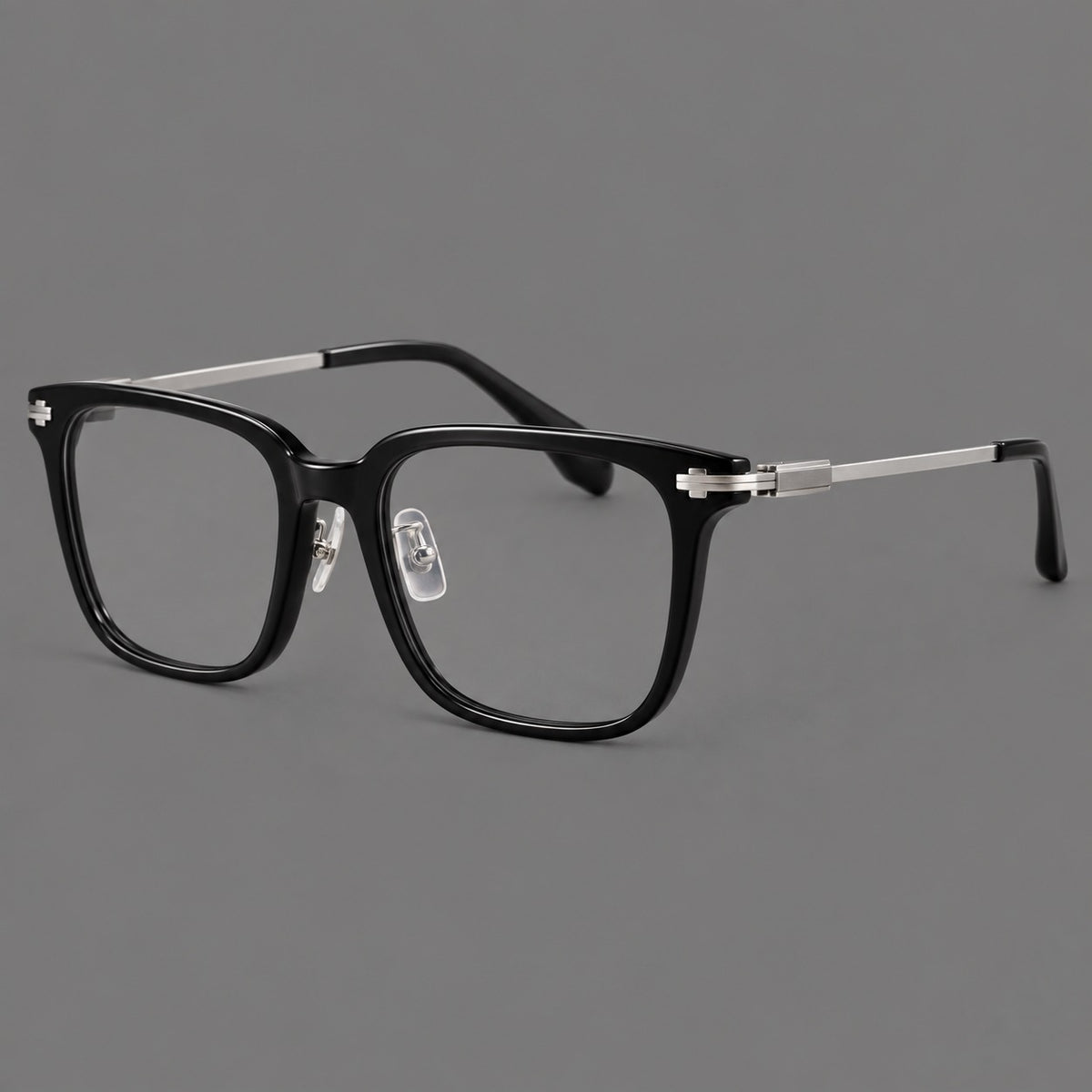 Classic acetate and titanium eyeglasses with broad square rims and textured metal temples in Black / Silver, three quarter view
