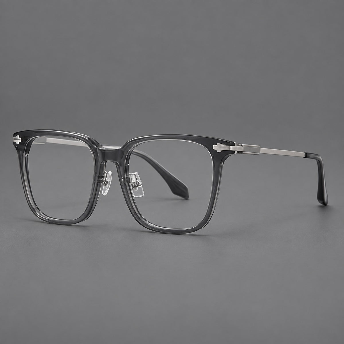Classic acetate and titanium eyeglasses with broad square rims and textured metal temples in Clear Grey / Silver, three quarter view