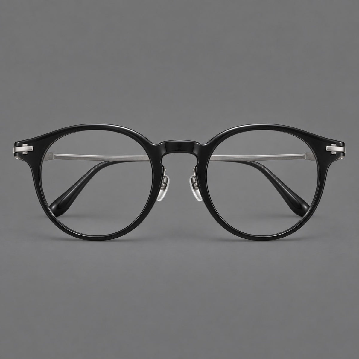 Retro acetate and titanium eyeglasses with round rims and a pronounced keyhole bridge in Black / Grey, front view
