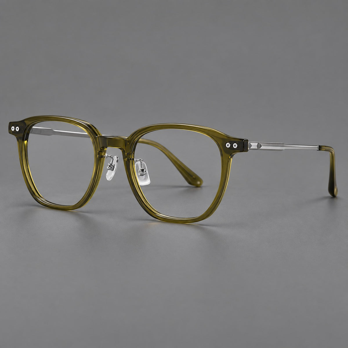 Vintage acetate and titanium eyeglasses with rounded square rims and slotted metal temples in Clear Olive Green / Silver, three quarter view