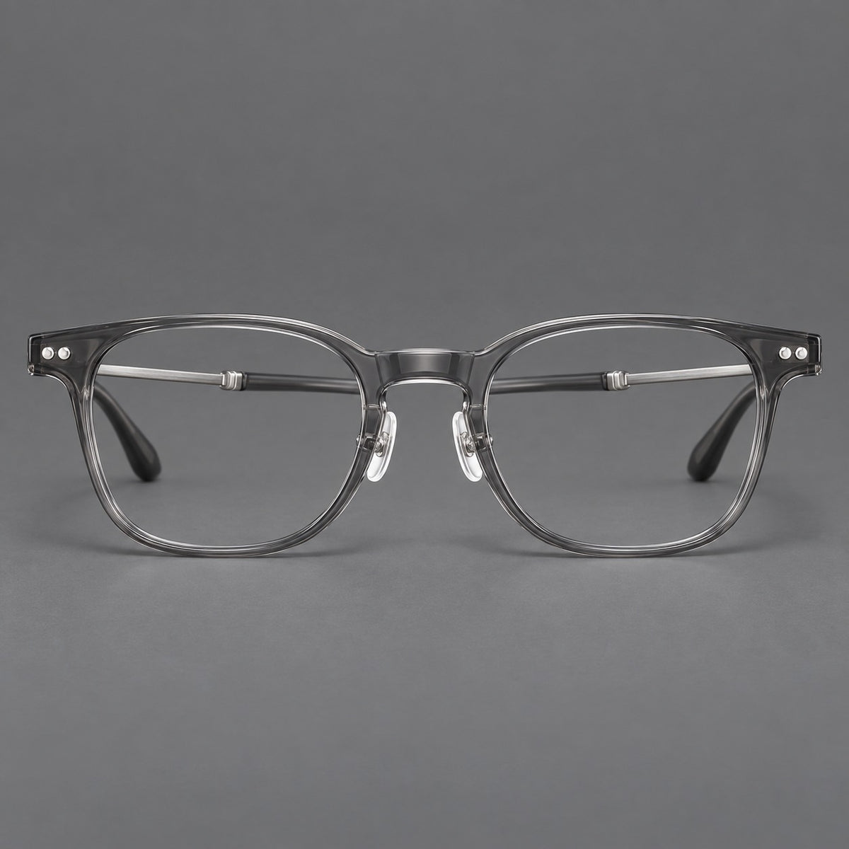 Vintage acetate and titanium eyeglasses with soft square rims and paired metal rivets in Clear Grey / Brushed Grey, front view
