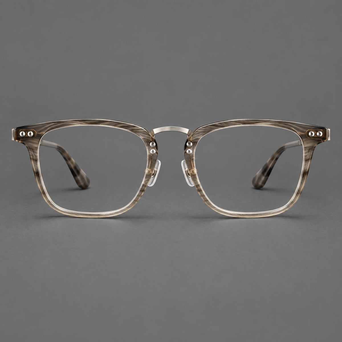 Acetate and titanium eyeglasses with soft square rims and an arched metal bridge in Grey Woodgrain / Silver, front view