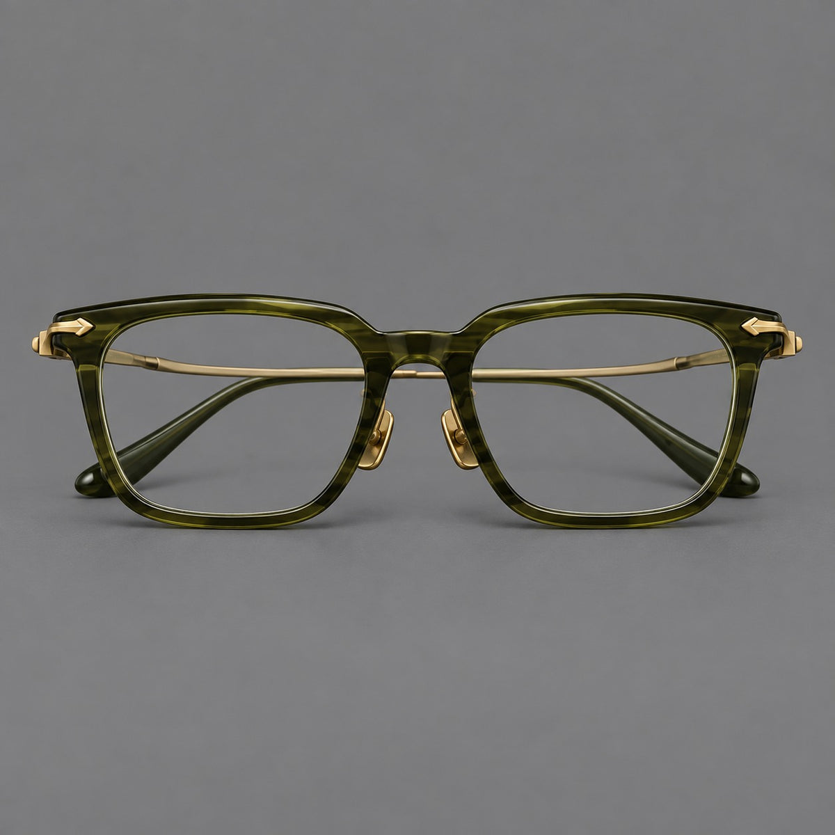 Bold acetate and titanium eyeglasses with rectangular rims and sculpted arrow accents in Army Green / Antique Bronze, front view