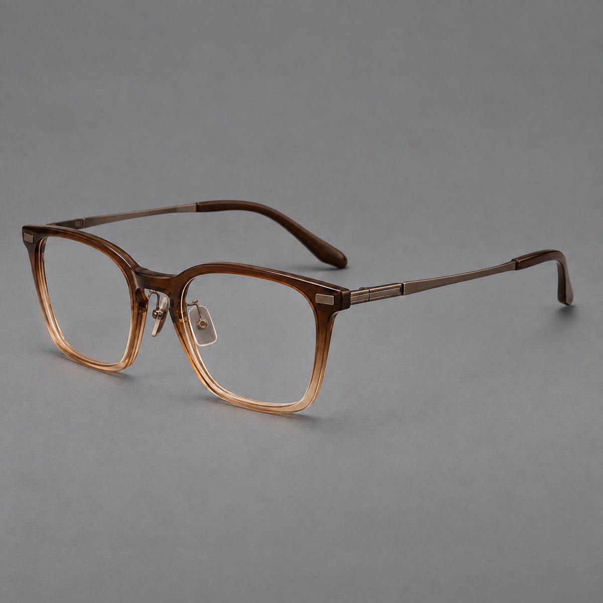 Classic acetate and titanium eyeglasses with rounded square rims and textured corner accents in Brown Gradient / Antique Bronze, three quarter view