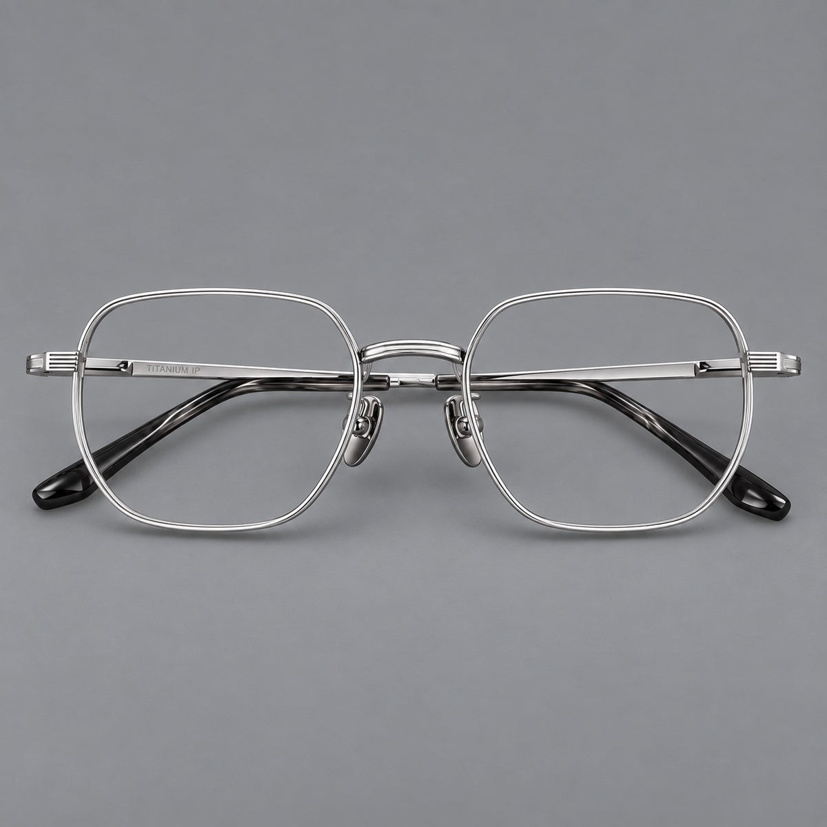 Retro square titanium glasses with rounded rims and finely grooved shoulders in Silver, front view