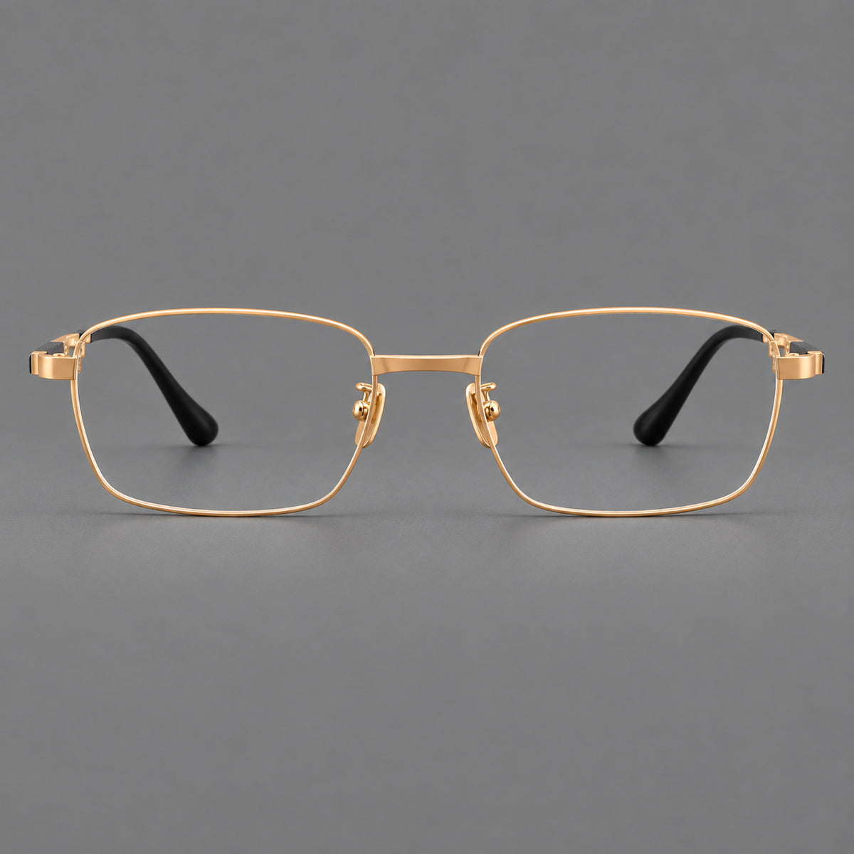 Slim rectangular titanium glasses with broad temples and contrasting dark inserts in Gold, front view