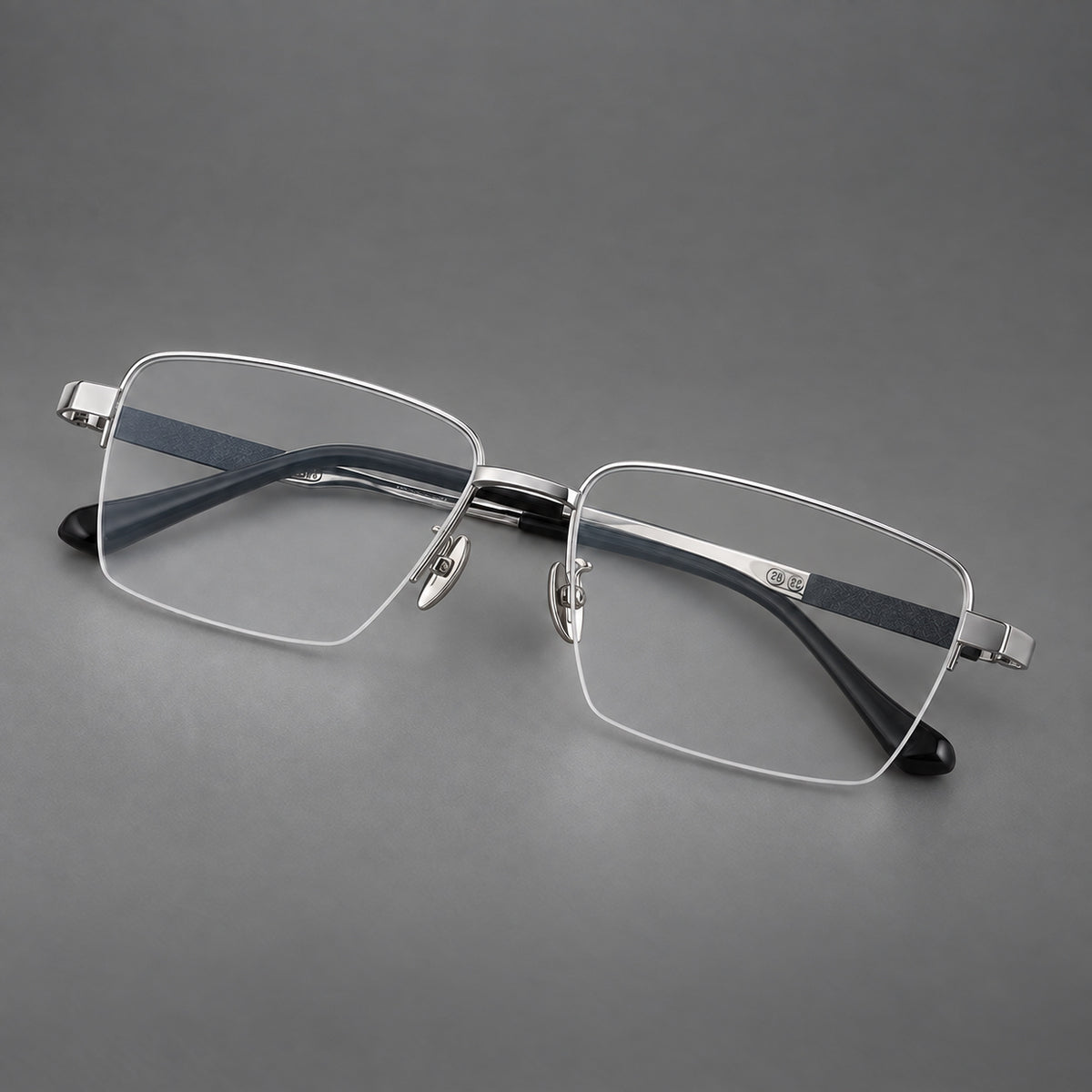 Wide half frame titanium glasses with rectangular lenses and textured temples in Silver, three quarter view