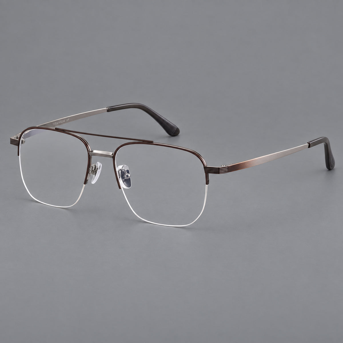 Angular aviator titanium glasses with a double bridge and an open lower rim in Brown and Silver, three quarter view