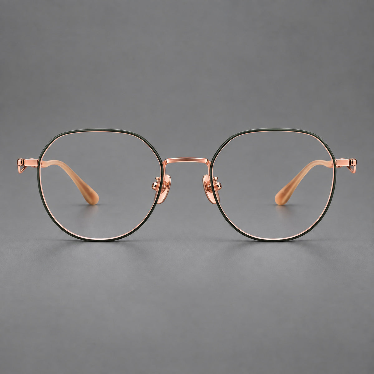 Rounded titanium glasses with a short bridge and distinctive wavy metal temples in Dark Green and Rose Gold, front view