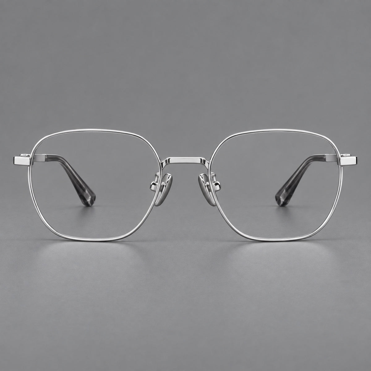 Rounded panto titanium glasses with an angular bridge and broad flat temples in Silver, front view
