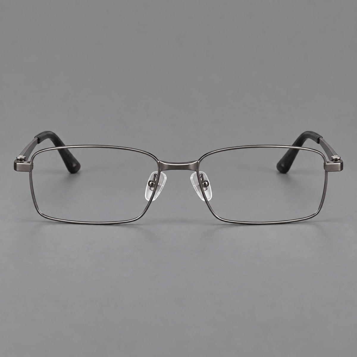 Wide rectangular titanium glasses with a broad bridge and rounded hinge caps in Gunmetal, front view