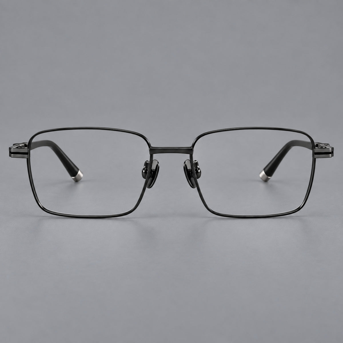 Rectangular titanium glasses with inset corner lines and metal capped temple tips in Black, front view