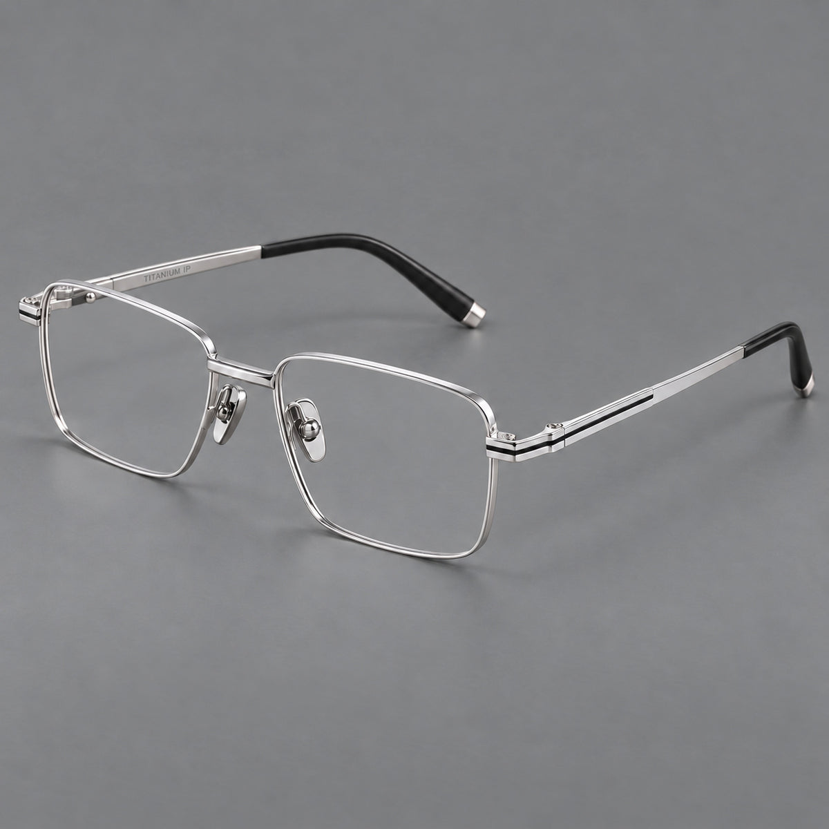 Rectangular titanium glasses with inset corner lines and metal capped temple tips in Silver, three quarter view