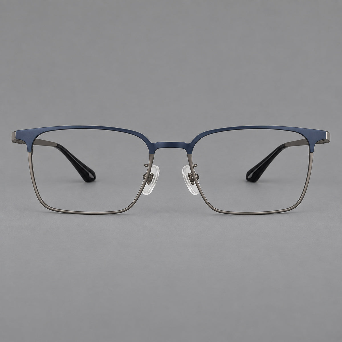 Bold rectangular titanium glasses with strong upper corners and flat metal temples in Blue and Gunmetal, front view