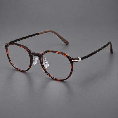Retro round plastic eyeglasses with a curved bridge and slim metal corner accents in Tortoiseshell, three quarter view additional product view
