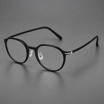 Retro round plastic eyeglasses with a curved bridge and slim metal corner accents in Glossy Black, three quarter view