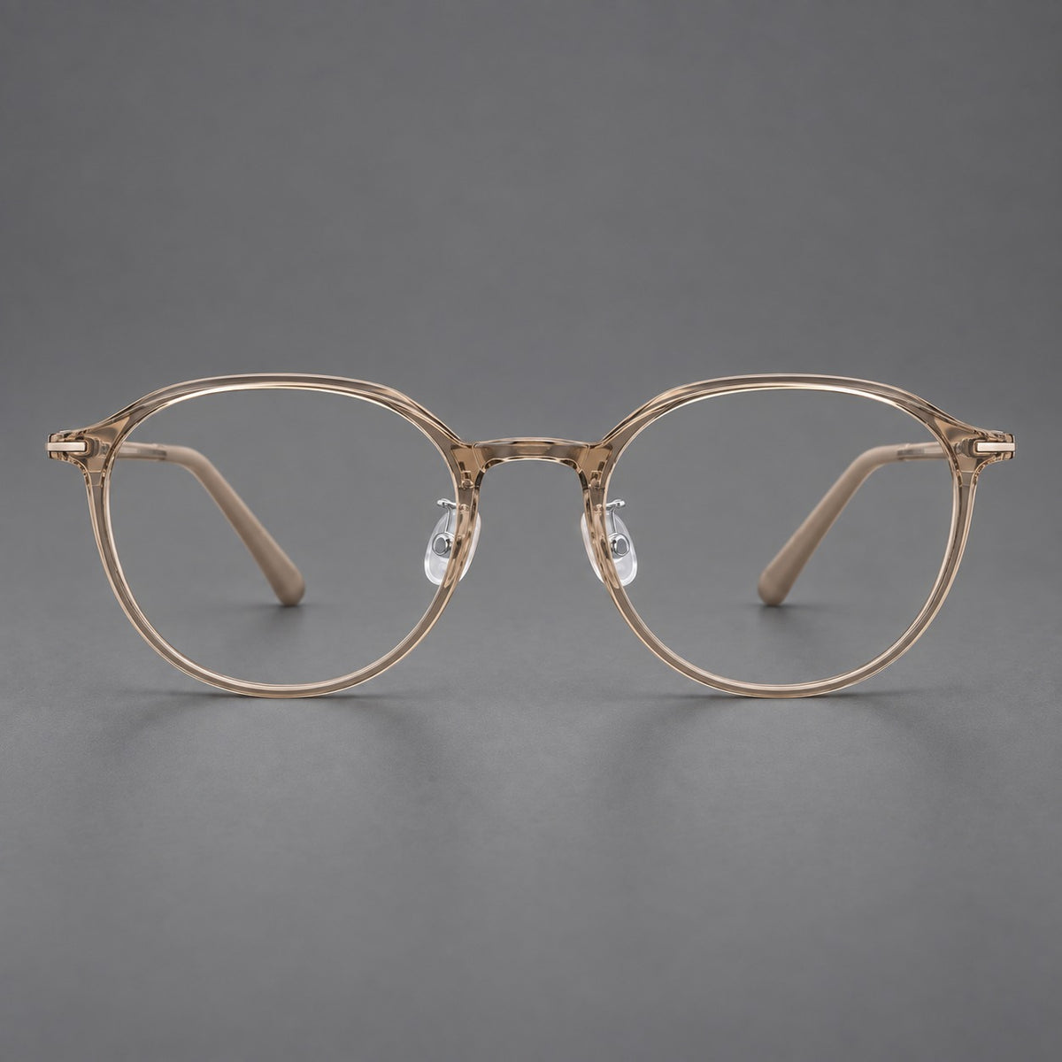 Retro round plastic eyeglasses with a curved bridge and slim metal corner accents in Tea, front view