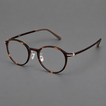 Compact round plastic eyeglasses with gently lifted corners and clear nose pads in Tortoiseshell, three quarter view additional product view