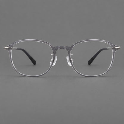 Soft square plastic eyeglasses with a raised browline and rounded lower corners in Clear Grey, front view frame detail