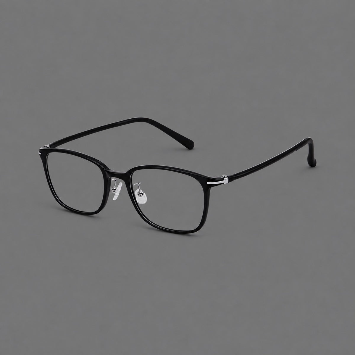 Classic square plastic eyeglasses with broad lenses and softly rounded edges in Glossy Black, three quarter view