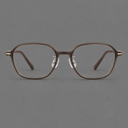 Rounded geometric plastic eyeglasses with softly angled rims and a curved bridge in Ink Brown, front view temple detail