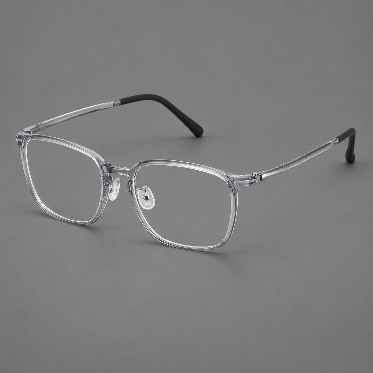 Bold square plastic eyeglasses with a defined browline and an open bridge in Clear Grey, three quarter view