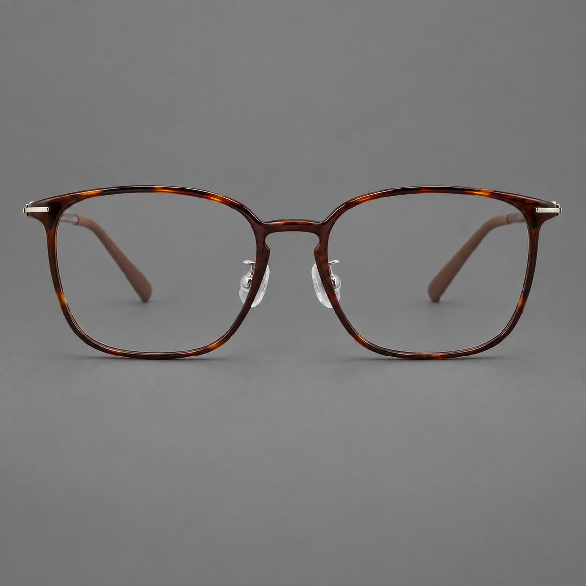 Bold square plastic eyeglasses with a defined browline and an open bridge in Tortoiseshell, front view