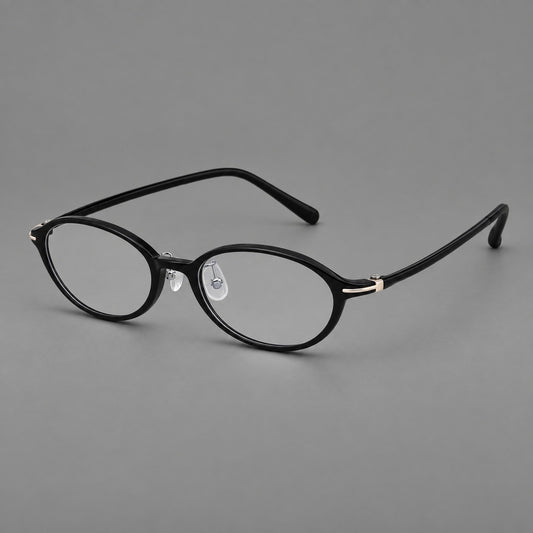 Vintage oval plastic eyeglasses with a softly curved browline and slim corner accents in Glossy Black, three quarter view
