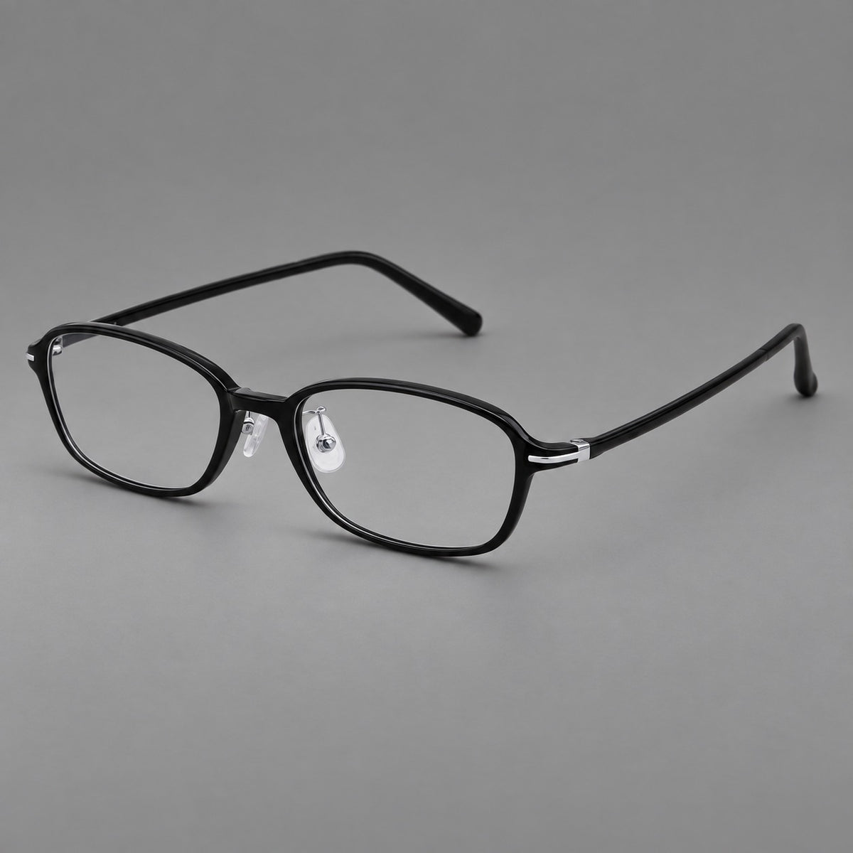 Soft oval plastic eyeglasses with a narrow bridge and gently rounded outer corners in Glossy Black, three quarter view