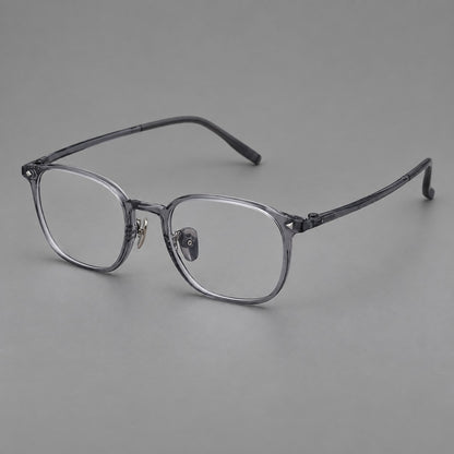 Retro square plastic eyeglasses with a curved bridge and triangular corner details in Ink Grey, three quarter view front view