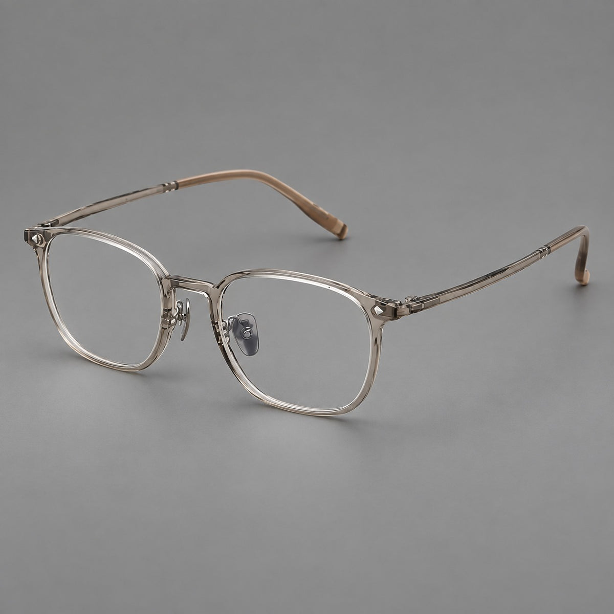 Retro square plastic eyeglasses with a curved bridge and triangular corner details in Grey Tea, three quarter view
