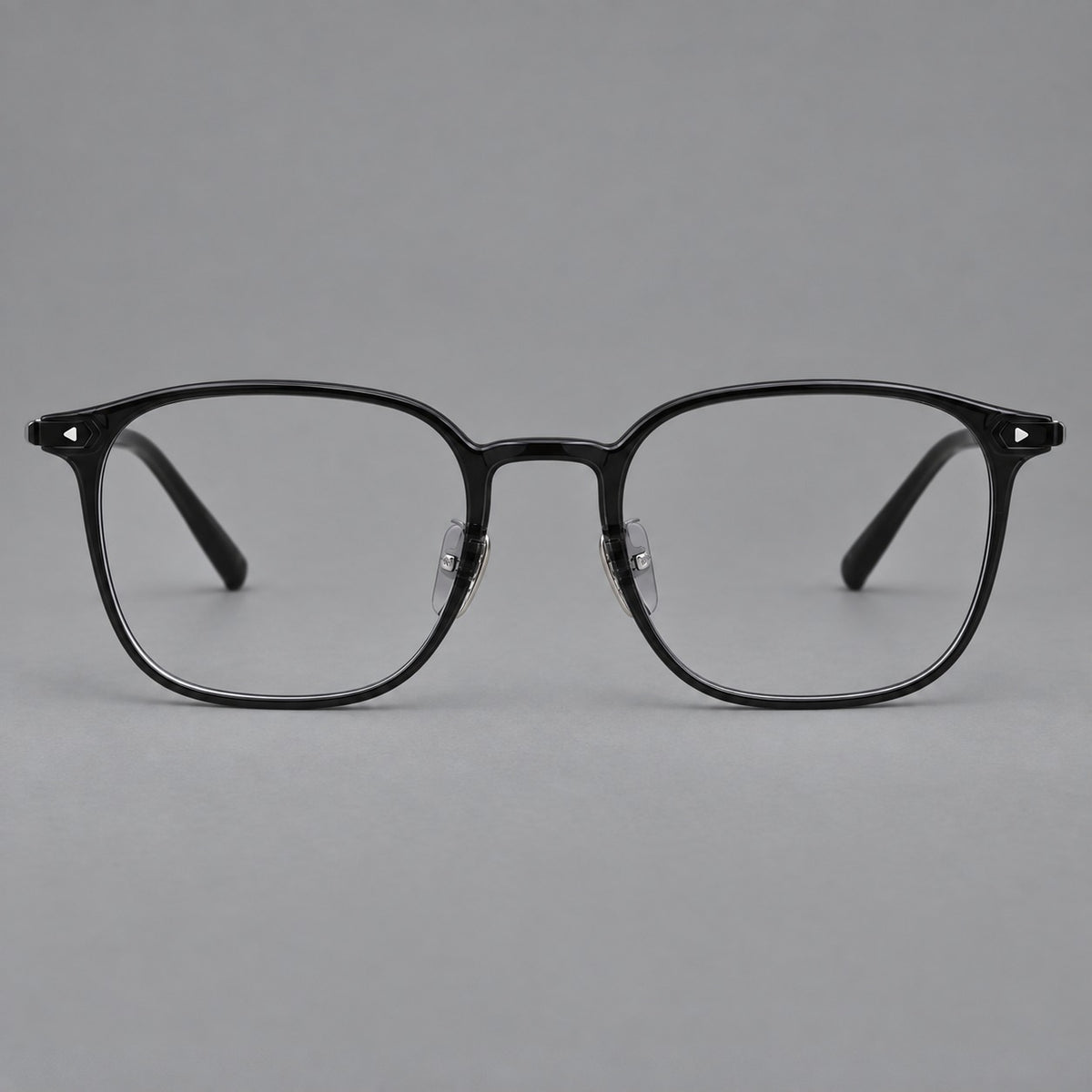Retro square plastic eyeglasses with a curved bridge and triangular corner details in Glossy Black, front view