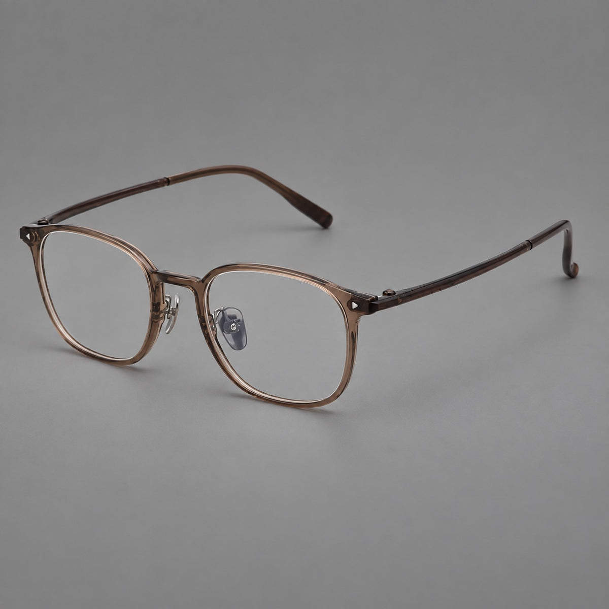 Retro square plastic eyeglasses with a curved bridge and triangular corner details in Brown, three quarter view