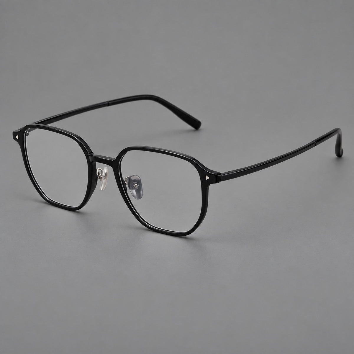 Soft square plastic eyeglasses with rounded lower rims and a broad curved bridge in Glossy Black, three quarter view