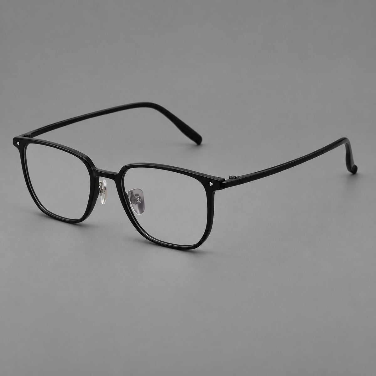 Refined rectangular plastic eyeglasses with raised outer corners and clear nose pads in Glossy Black, three quarter view